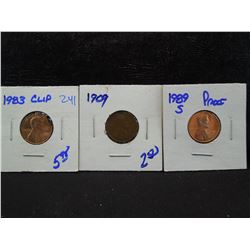 1909 wheat cent, 1983 memorial cent error coin with a rim clip, and a 1989-s proof memorial cent