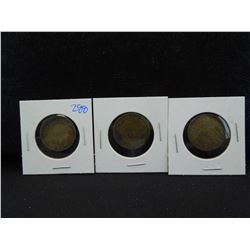 three vintage creamery tokens