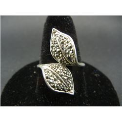 Ladies sterling ring.  CZ (diamond-like) stones in pattern.  Size 9