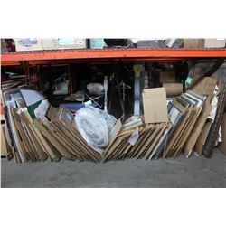 LARGE LOT OF ARTWORK UNDERNEATH PALLET RACKING