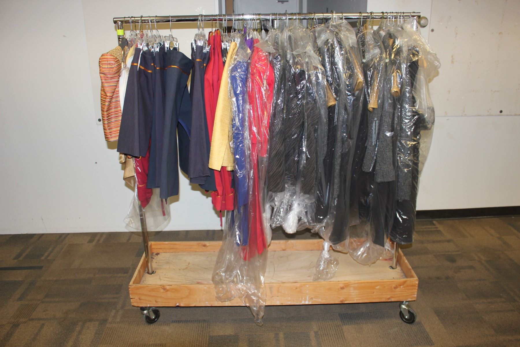 ROLLING RACK OF COSTUMES AND CLOTHING, RACK NOT INCLUDED