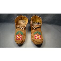 Nez Perce' moccasins, ankle high, partially beaded.