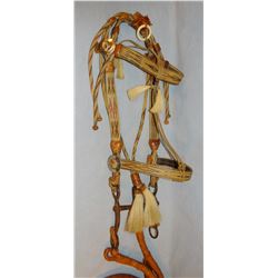 Hitched horsehair bridle with leather reins, possibly Deer Lodge