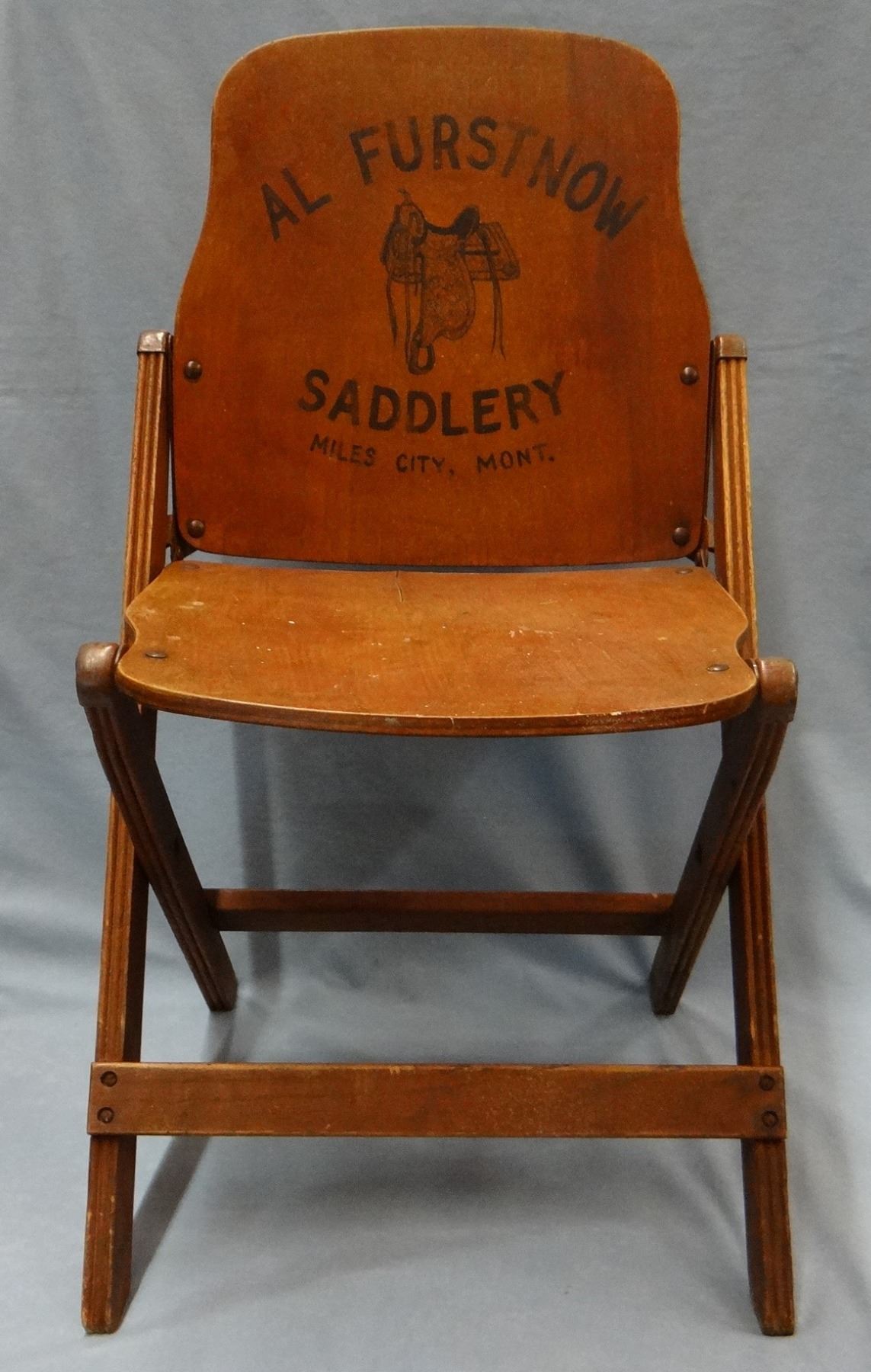Al Furstnow Saddlery advertising wooden folding chair ...