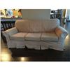 Image 1 : Covered couch - floral pattern underneath protective cover 6'8"W x 3'2"D x 2'7"H