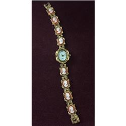 Elegant Ladies Gold Tone Quartz Watch with Unique Band