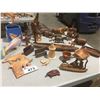 Image 1 : GROUP OF ASSTD WOOD CARVINGS/GIRAFFE/ZEBRA/ELEPHANTS/LION/HIPPO/LIGHTHOUSE/TOTEM POLES/FISH BOWLS