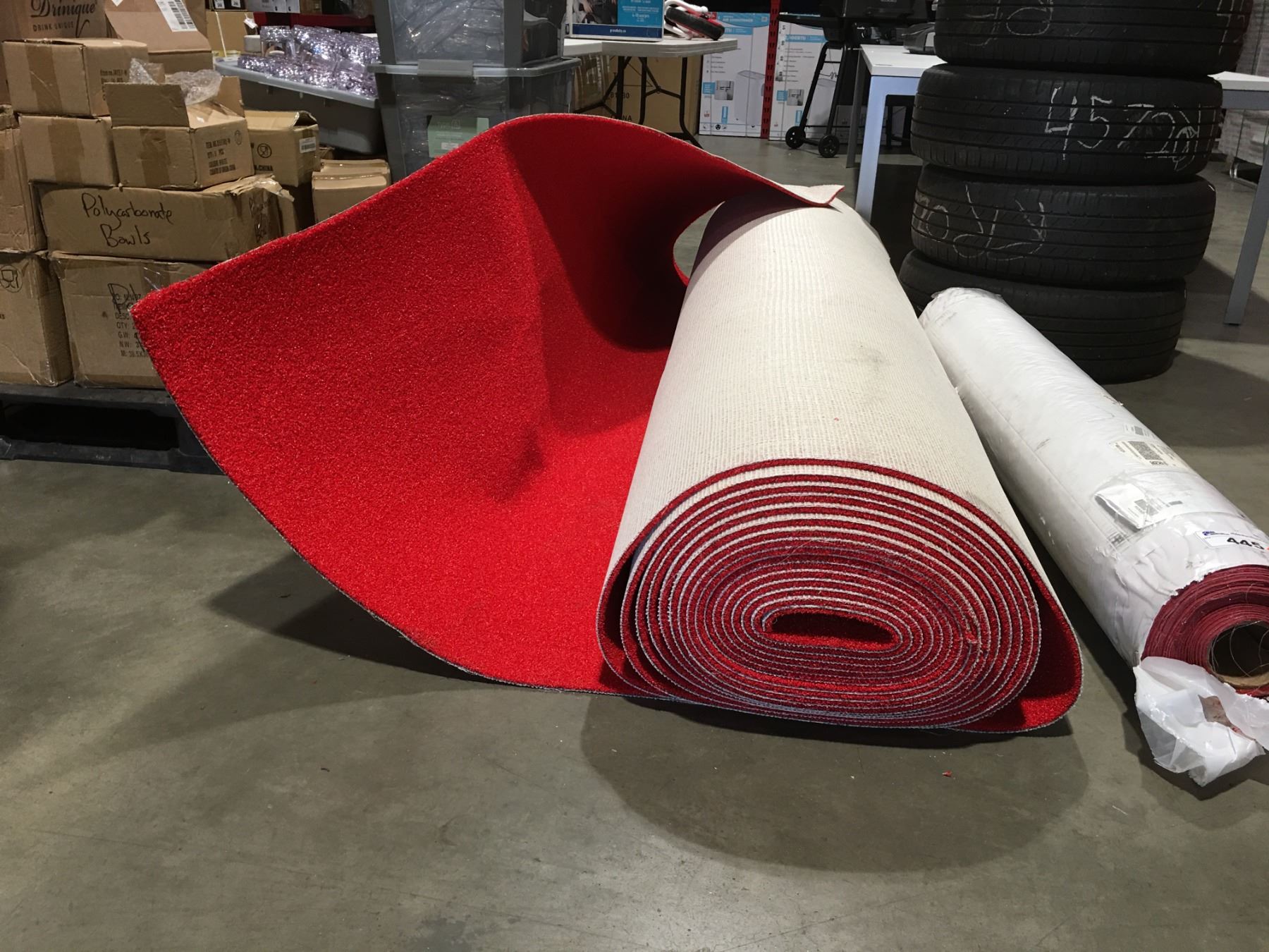RED INDOOR/OUTDOOR CARPET ON BACKING (8' WIDE APPROX 490 SQ FT)