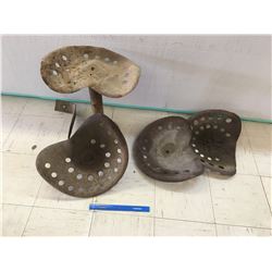 LOT OF OLD STEEL IMPLEMENT SEATS