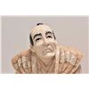 Image 2 : Two Oriental figures on wooden stands including one 9" in height