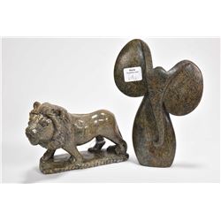 Two carved soapstone figures including a lion 5" in length and a stylized 7 1/4" elephant