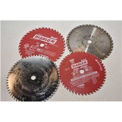 Three used 7" circular saw blades and one 6 1/2" circular saw blade