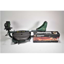 Caldwell lead sled gun rest and a Bushmaster 20-60X60 spotting scope with tri-pod, appears new in bo