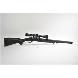 Non-Restricted rifle Traditions model Buck Stalker, .50 cal 1/28  single shot hinge break, w/ bbl le