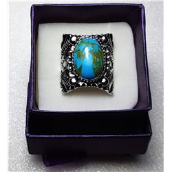 11)  HEAVILY CARVED OVAL TURQUOISE AND