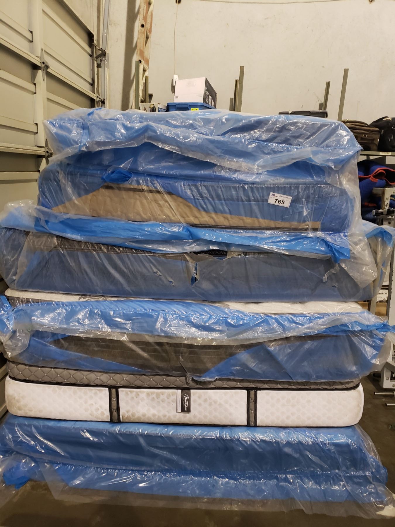 STACK OF ASSORTED MATTRESSES