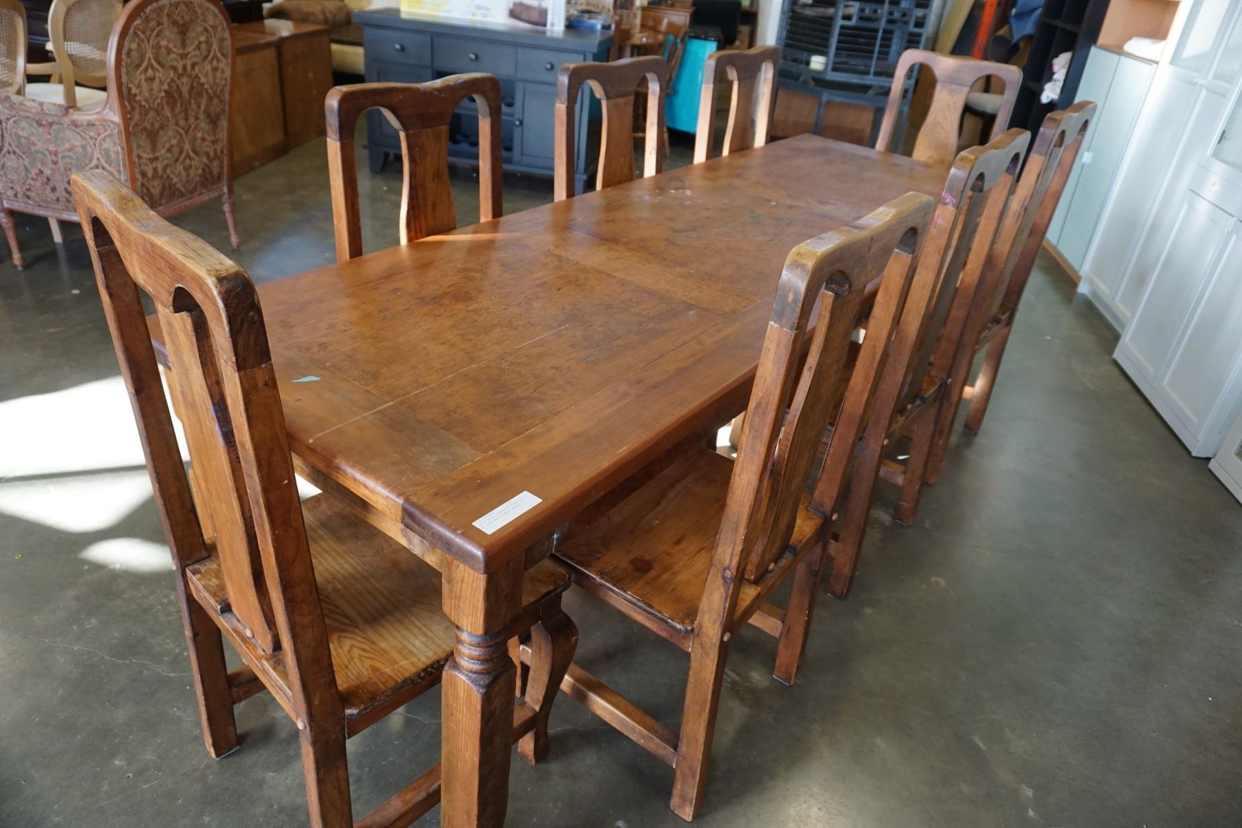 LARGE RUSTIC HARVEST TABLE 8FT BY 32IN AND 8 WOOD CHAIRS