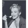 Image 1 : André DE DIENES - Marilyn Monroe at an ice cream palour in 1953.
