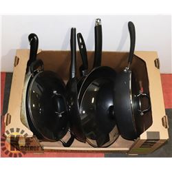 LARGE LOT OF SKILLETS AND PANS. SOME WITH LIDS
