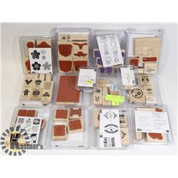 15 NEW INK STAMPS IN PACKAGING IN A BAG.