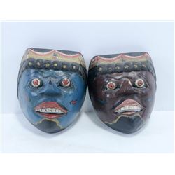 PAIR OF HAND CARVED WOODEN MASKS.