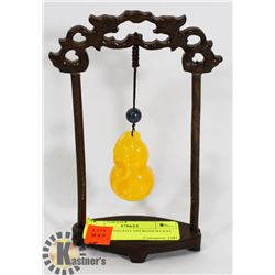 JADEITE PENDANT ON ROSEWOOD STAND