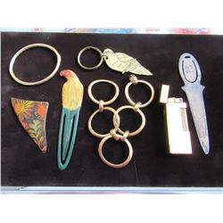 BOX WITH BRACELETS, BOOK MARKS, LETTER OPENERS, LIGHTER & KEY CHAINS (7 PIECES)