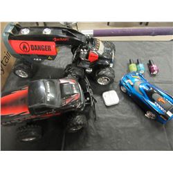 BOX WITH TOY TRUCKS, NAIL POLISH, HEAD PHONES, ETC