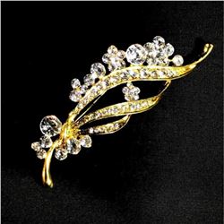 Contemporary designer brooch with rhinestones.