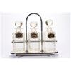 Image 2 : A Tantalus decanter set.