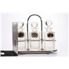 Image 8 : A Tantalus decanter set.