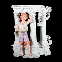 A German porcelain boy vase.