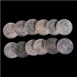 Twelve Chinese emperor coins.