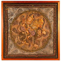 A framed Thai embroidery.