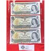 Image 1 : Lot of 3 1973 Bank of Canada $1 Bank Notes in a Sheet Protector