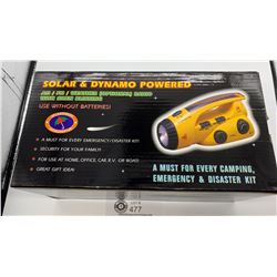 New In Box Solar and Dynamo Powered AM/FM Radio Flashlight