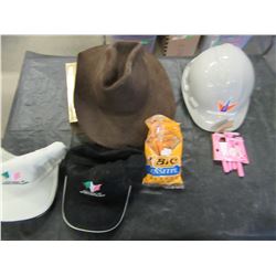 GREEN TOTE WITH HARD HAT, COWBOY HATS, SHAVERS, ETC