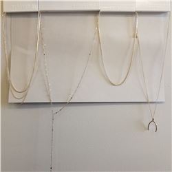 4 Pieces of Forever 21 Fashion Jewelry. 4 simplistic chains, one with wish bone pendent