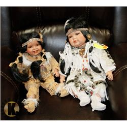 PAIR OF PORCELAIN NATIVE GIRL DOLLS