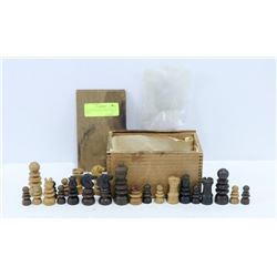 ANTIQUE WOODEN CHESS PIECES IN BOX.