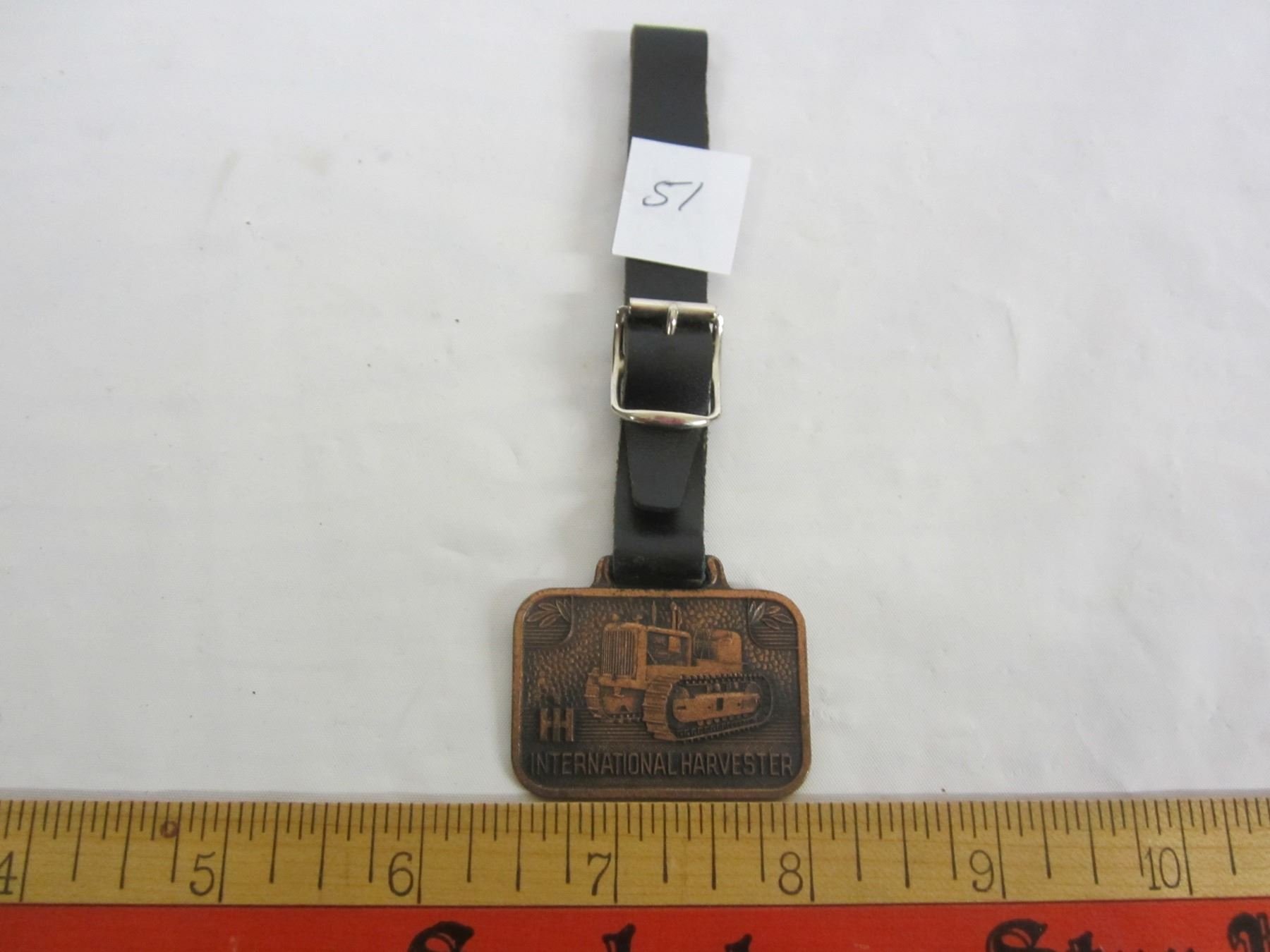 International Harvester watch fob Schmalz Auctions