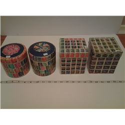 4 STAMP CONTAINERS WITH STAMPS INSIDE