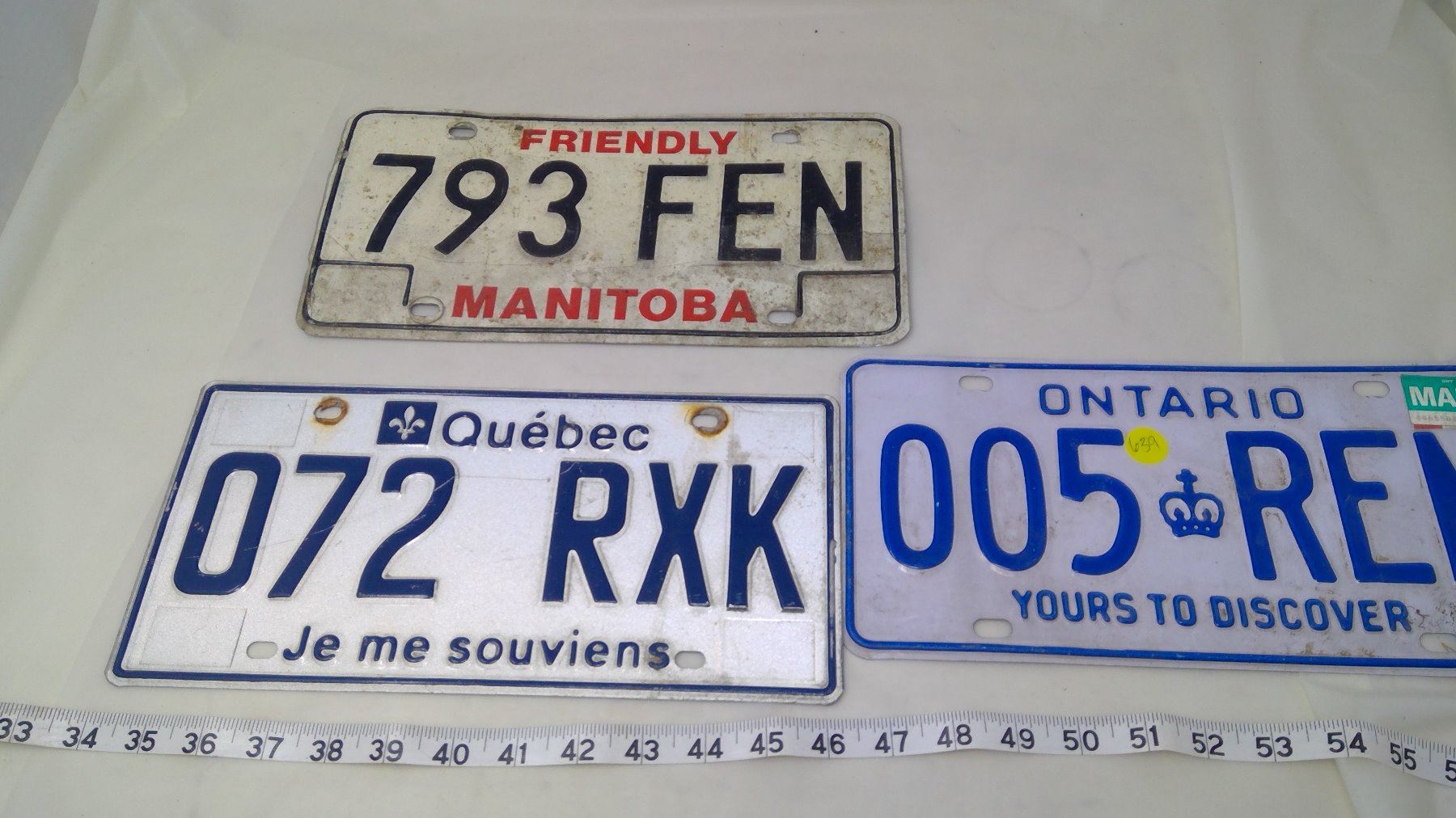 THREE LICENSE PLATES