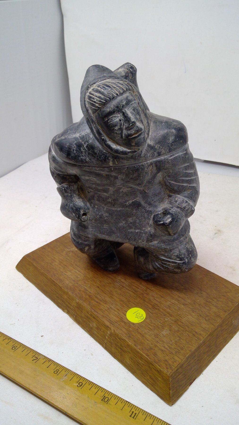 CANADIAN INUIT STONE CARVING MAN WITH SEAL ON HIS BACK