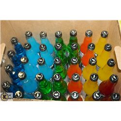 BOX OF 34 ASSORTED FLAVORS OF JONES SODA POP.