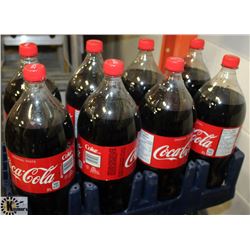 8- 2LTR BOTTLES OF ORIGINAL COCA COLA POP.