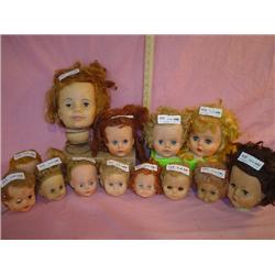 Tray of 13 Doll Heads. All have moveabl