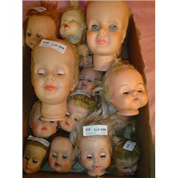 Box of 19 Doll Heads. Most are missing 