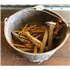 Image 1 : CAST POT FILLED WITH SQUARE NAILS