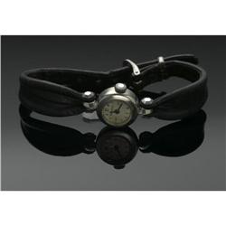 A LADY'S LEATHER AND GOLD WRIST WATCH, BULOVA A LADY'S LEATHER AND GOLD WRISTWATCH